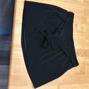 Black belted mini skirt